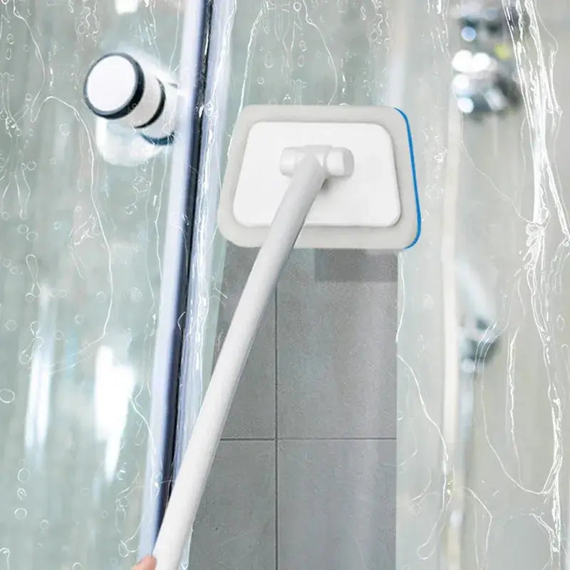 Bathroom sponge cleaning brush by Simples Market with long white handle and blue-edged removable head