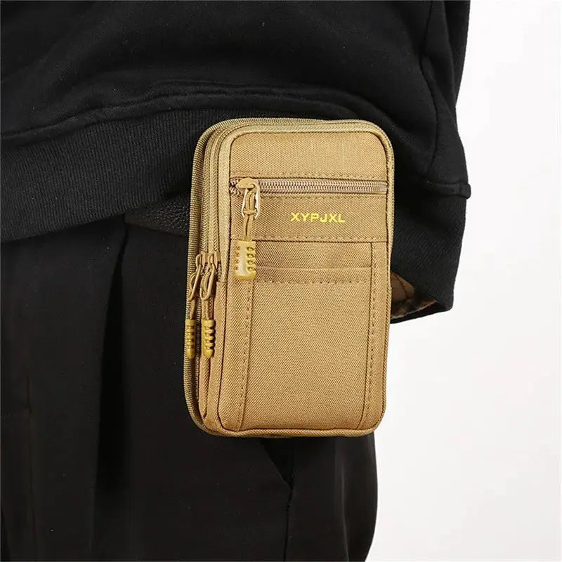 Tan nylon waist pack bum bag with multiple zip pockets worn on belt