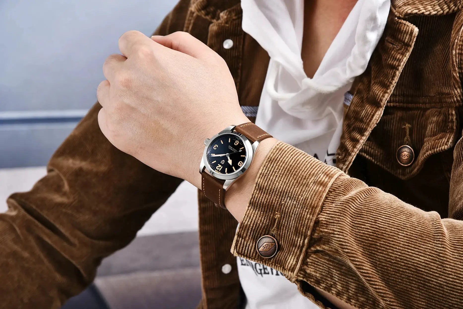 PAGANI DESIGN 36mm men's automatic wristwatch with brown leather strap and stainless steel case.