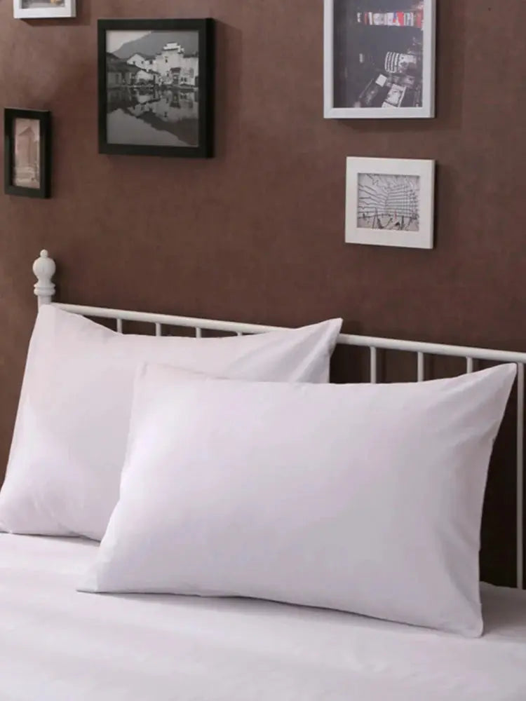Two white solid-color pillow covers 20 x 30 in (50 x 76 cm), rectangular bedding