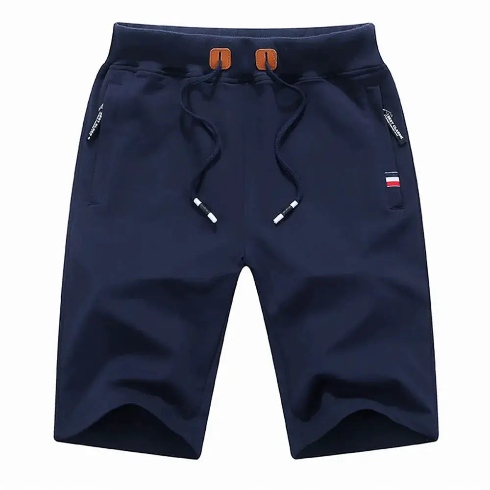Men's navy cotton shorts with drawstring waist, loose fit, side zip pockets, flag patch