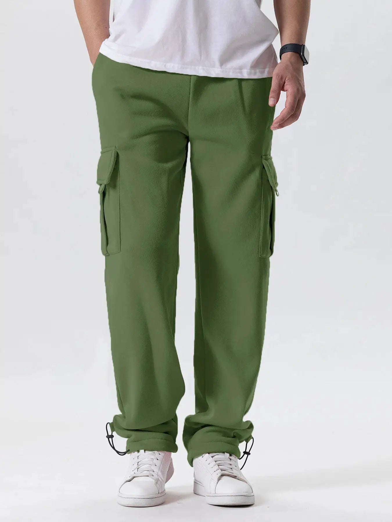 Men's olive green cargo joggers with side pockets and drawstring cuffs at ankles, loose straight fit