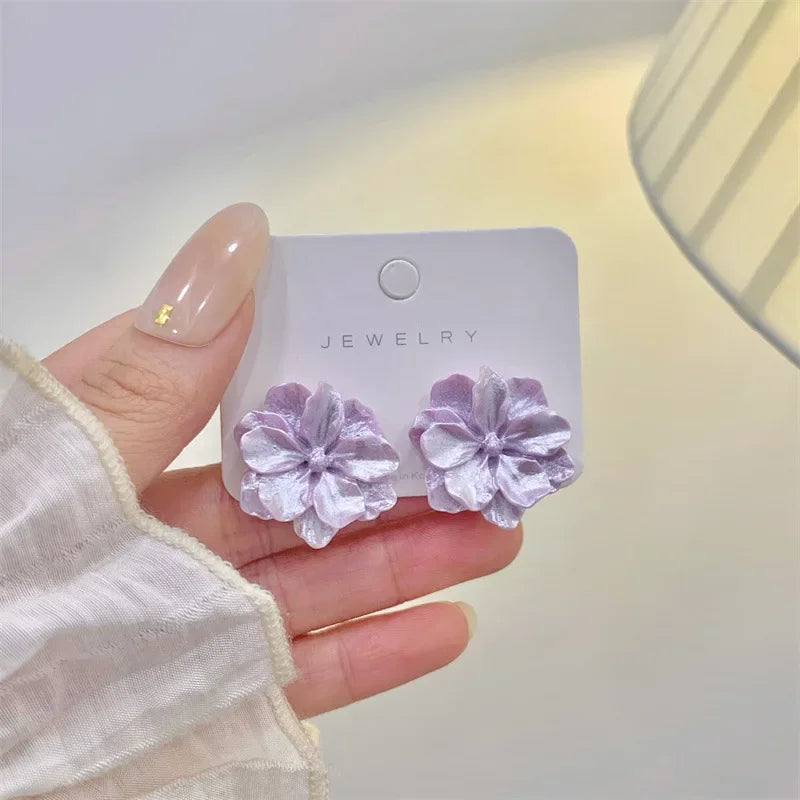 Lavender flower stud earrings for women on a jewelry card