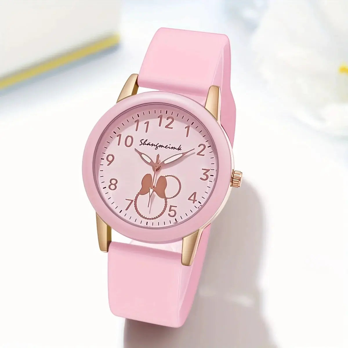 Pink round women's quartz watch with silicone strap and rose-gold case by Simples Market