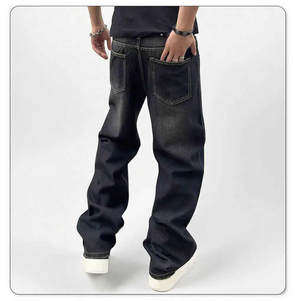 Men's black baggy straight-leg denim jeans with two back pockets and faded wash