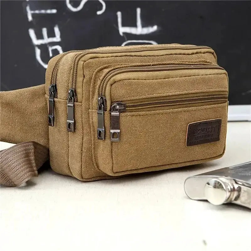 Tan canvas waist bag with multiple zip compartments and adjustable strap; high-capacity SPORT patch.