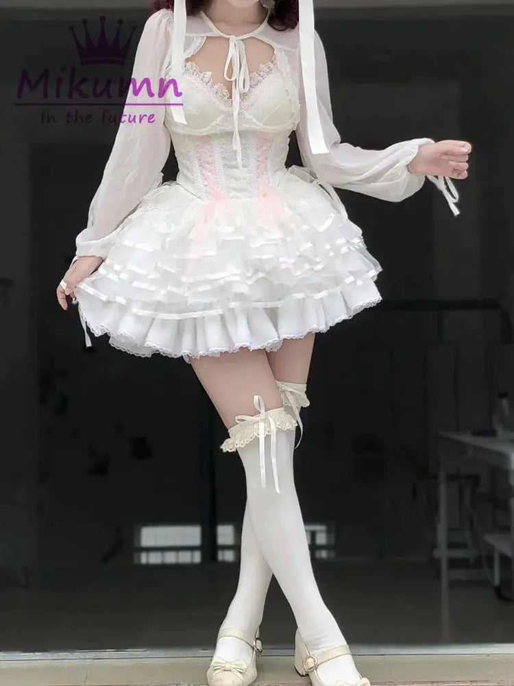 Lolita shorts set in white with layered ruffles and lace accents, plus thigh-high socks