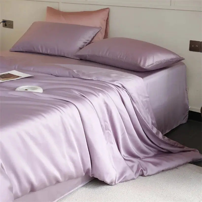 Mulberry silk bedding set by Simples Market in lavender; duvet cover, bedsheet and pillowcases on a bed