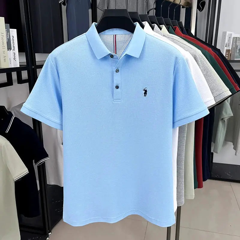 Men's light blue cotton polo shirt with polo collar, three-button placket, and small embroidery.