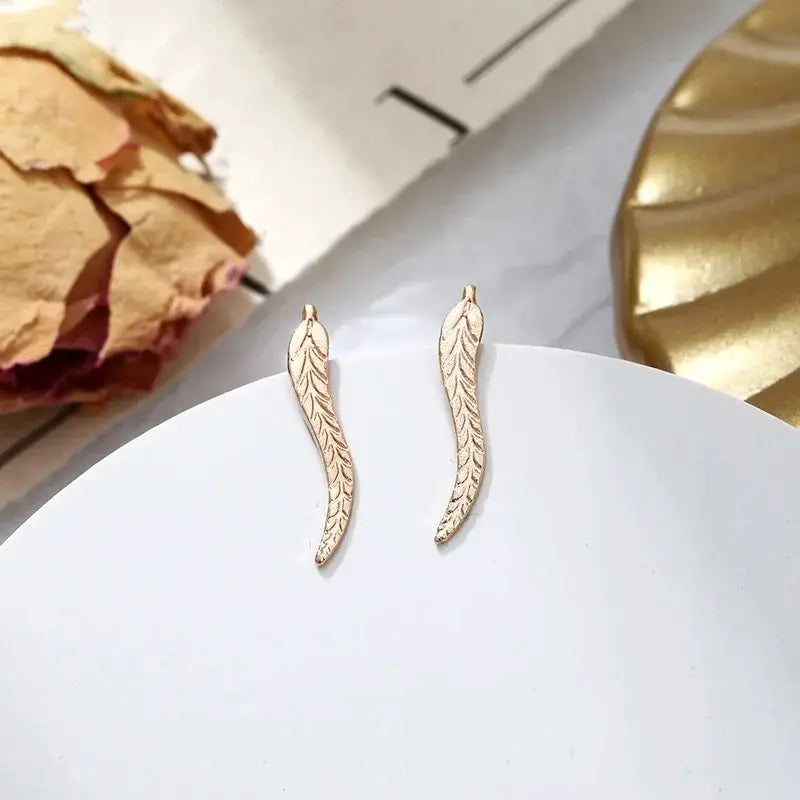 Gold-tone leaf feather stud earrings, a pair for women, curved vintage-style design