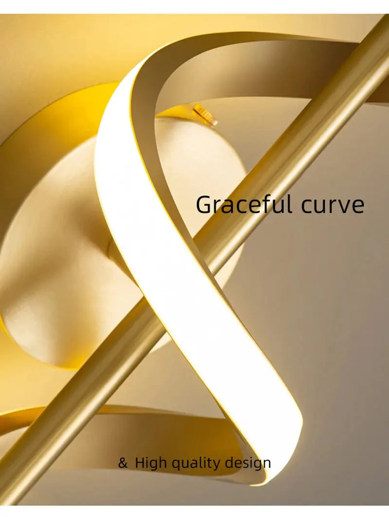 Lustre LED pendant light by Simples Market in gold metal with a graceful curved ring design.