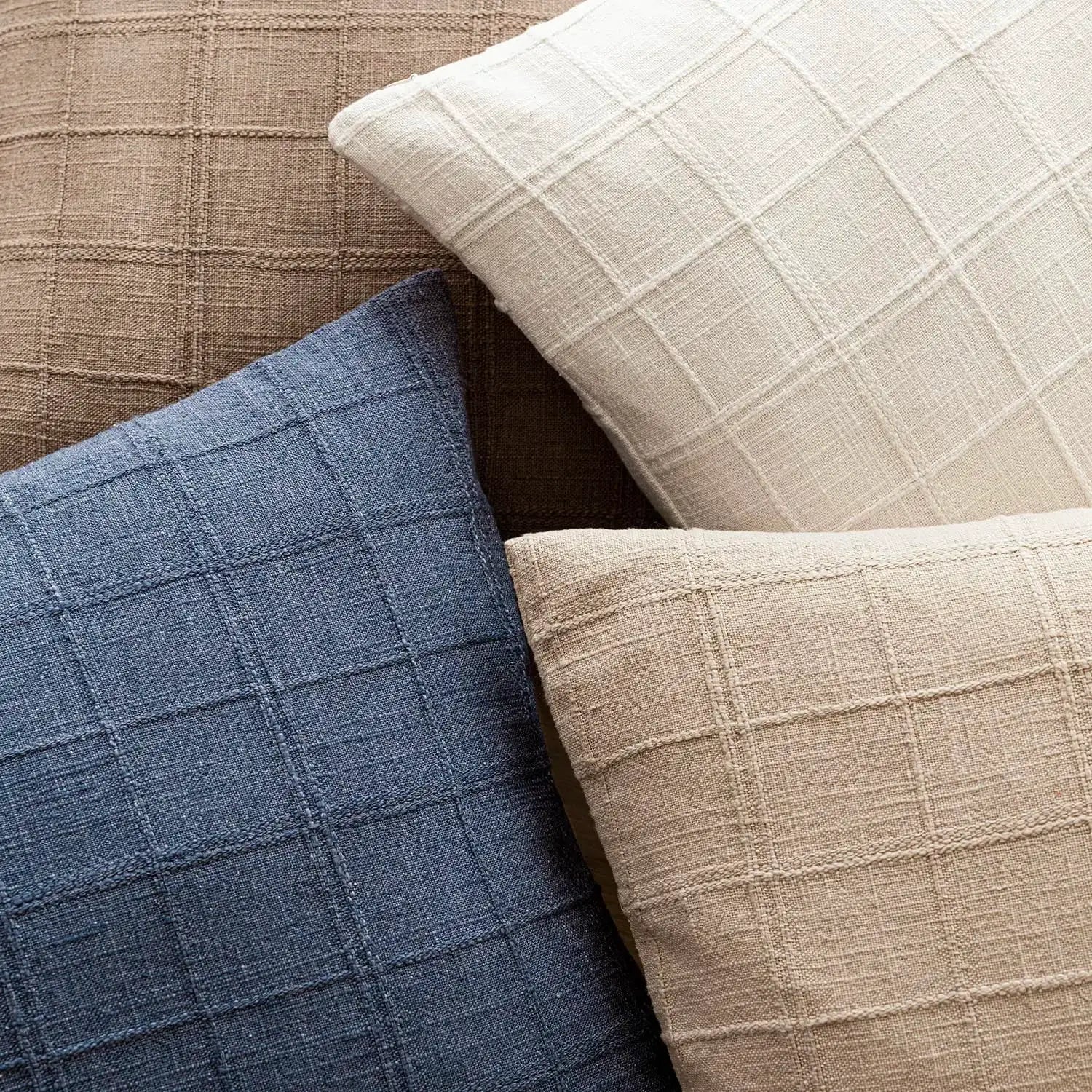 Square cushion covers in blue and beige linen with a grid pattern; decorative sofa pillow covers