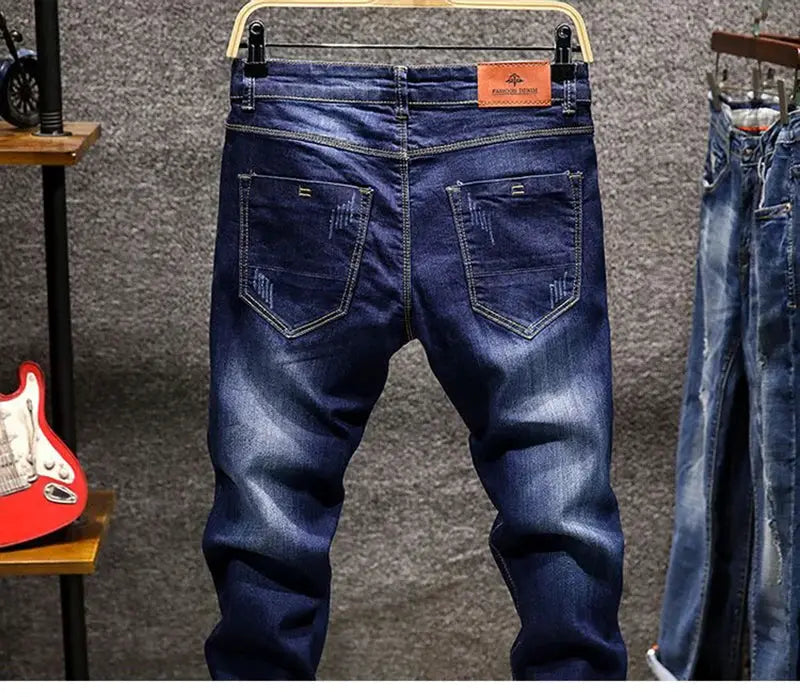 Simples Market men's elastic straight jeans, blue denim with distressed rips and back pockets.