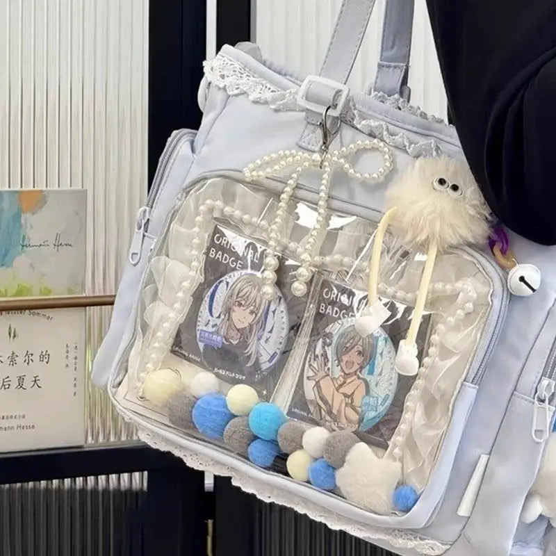 Ballet Girl Large Appetite itabag crossbody; light blue bag with clear front pocket and anime badge charms