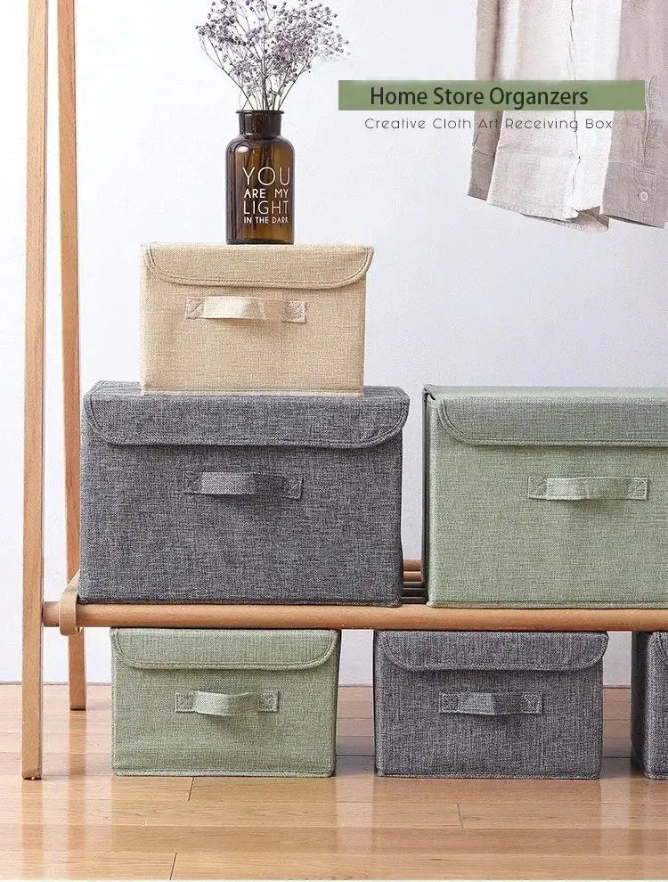 Washable cotton-linen fabric foldable storage boxes with lids in beige, gray, and sage green (6-pack) shown on a wooden bench