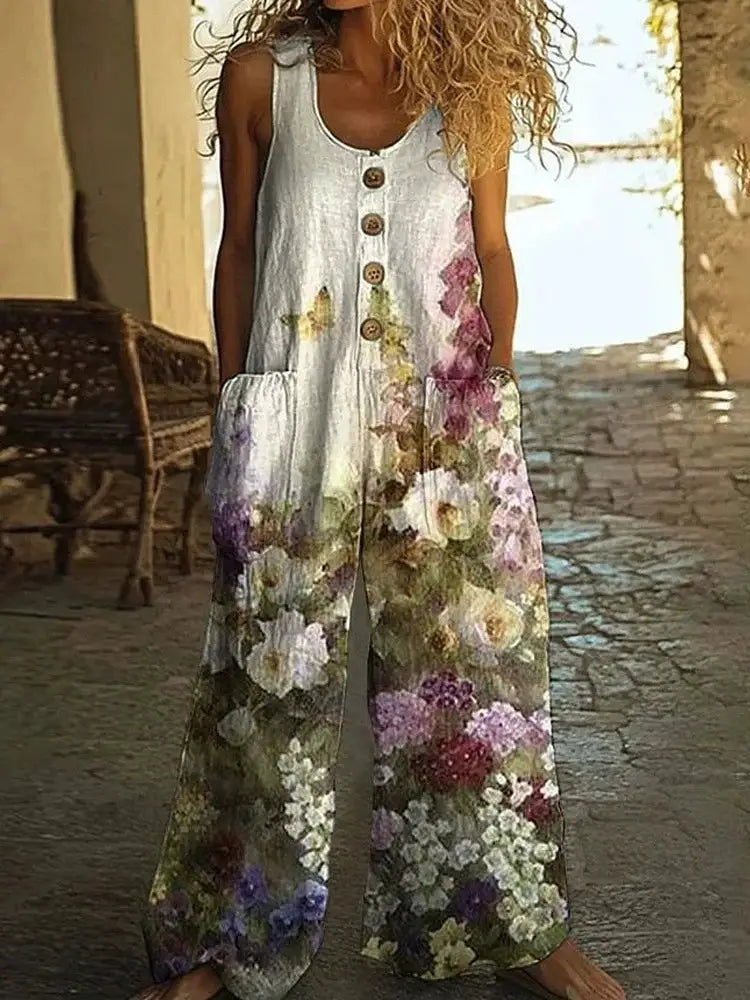 Vintage floral print sleeveless jumpsuit with button-front and loose wide-leg pants for summer wear.