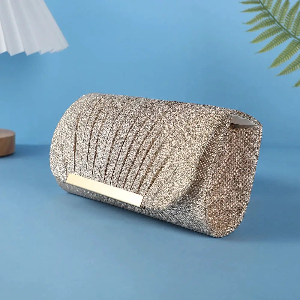 Metallic glitter clutch bag by Simples Market with pleated sequins and gold-tone bar, evening bag
