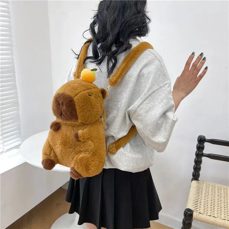 Capybara plush backpack by Simples Market, brown fuzzy crossbody bag with orange straps