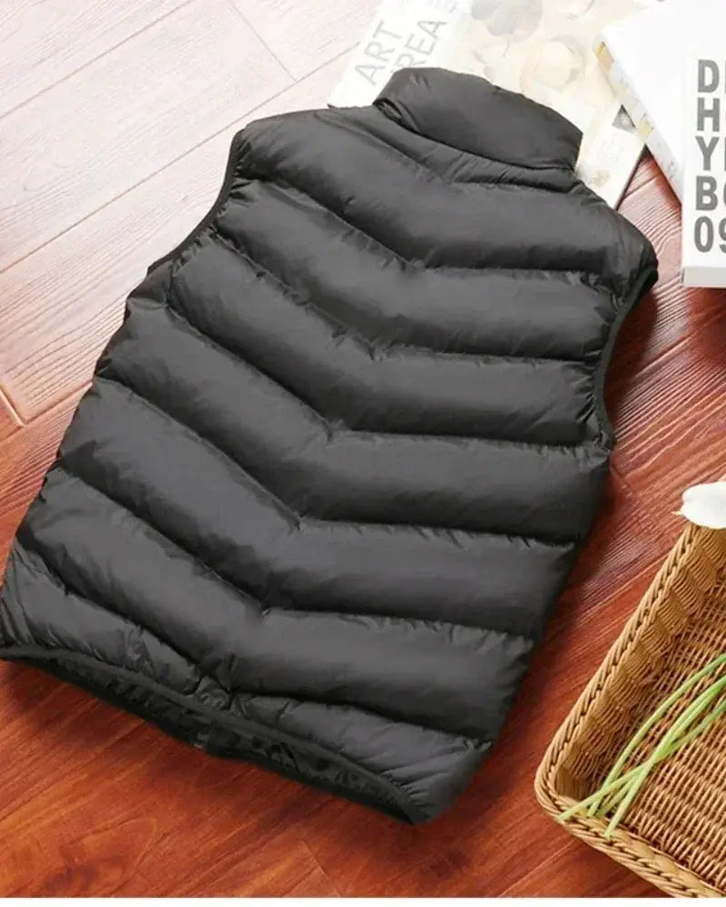 Men's black sleeveless down-filled puffer vest with horizontal quilting