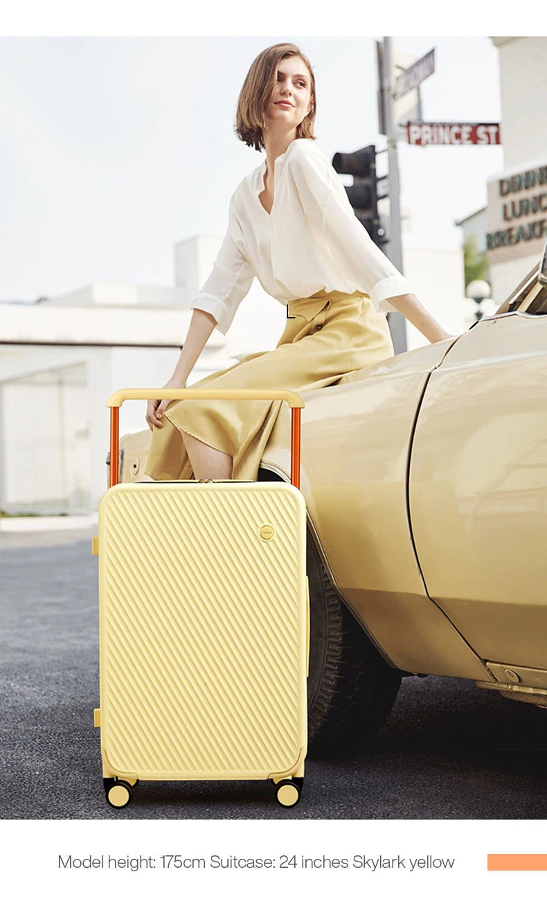 Simples Market Mixi yellow 24-inch hardside luggage with wide handle and spinner wheels