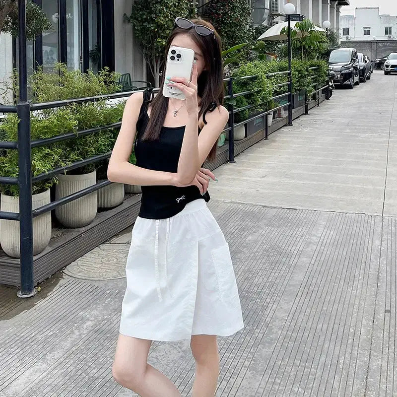 2-piece fake shorts-skirt set in white, high-waist A-line mini with side slit and lightweight fabric