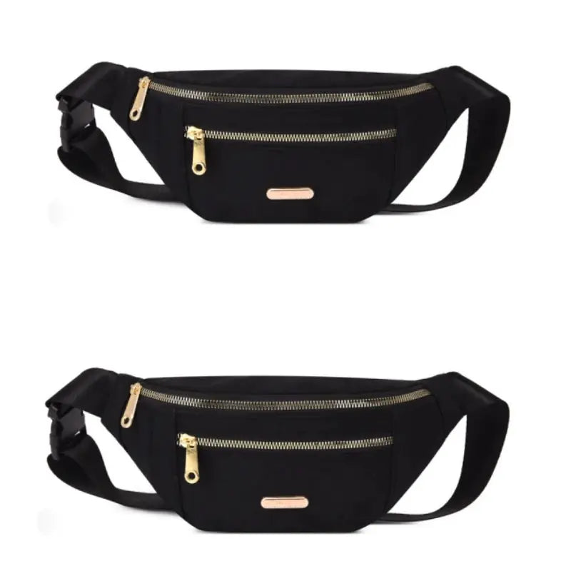 Two black Simples Market fanny packs with gold zippers and adjustable waist straps.