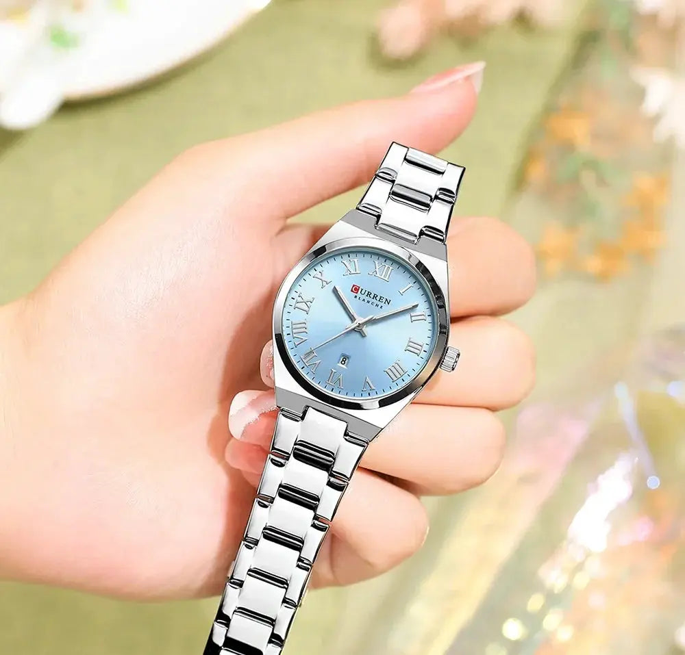 CURREN women's stainless steel watch with light blue dial, Roman numerals, date window