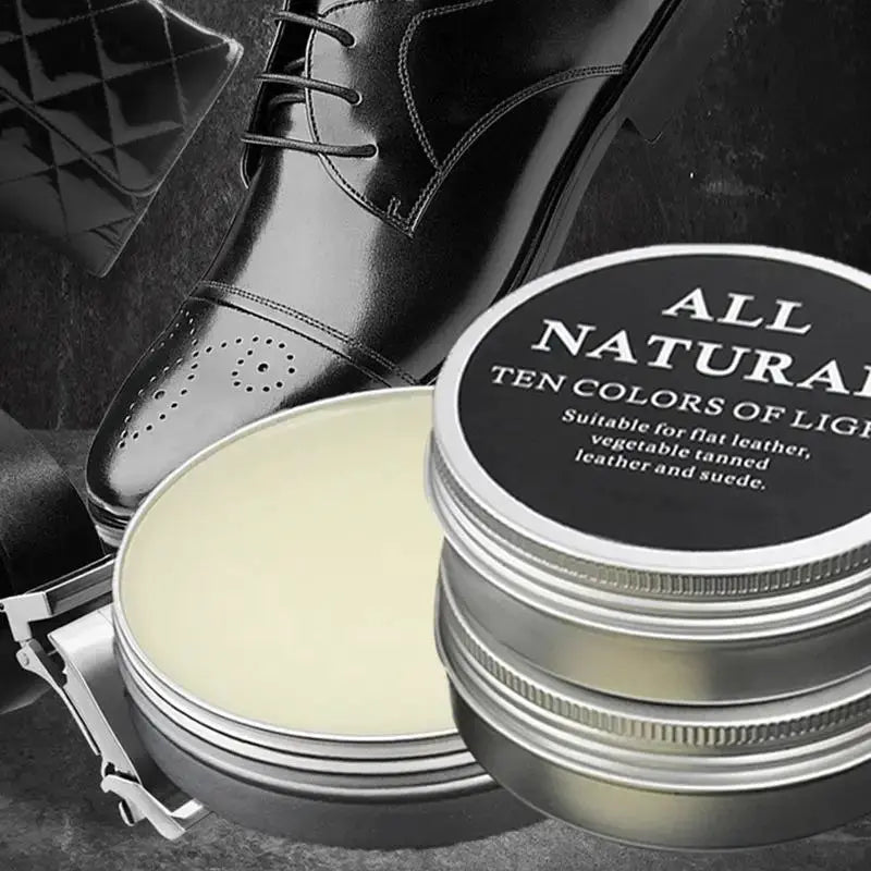 Leather care cream tins by Simples Market; two tins with a black polished leather shoe in the background