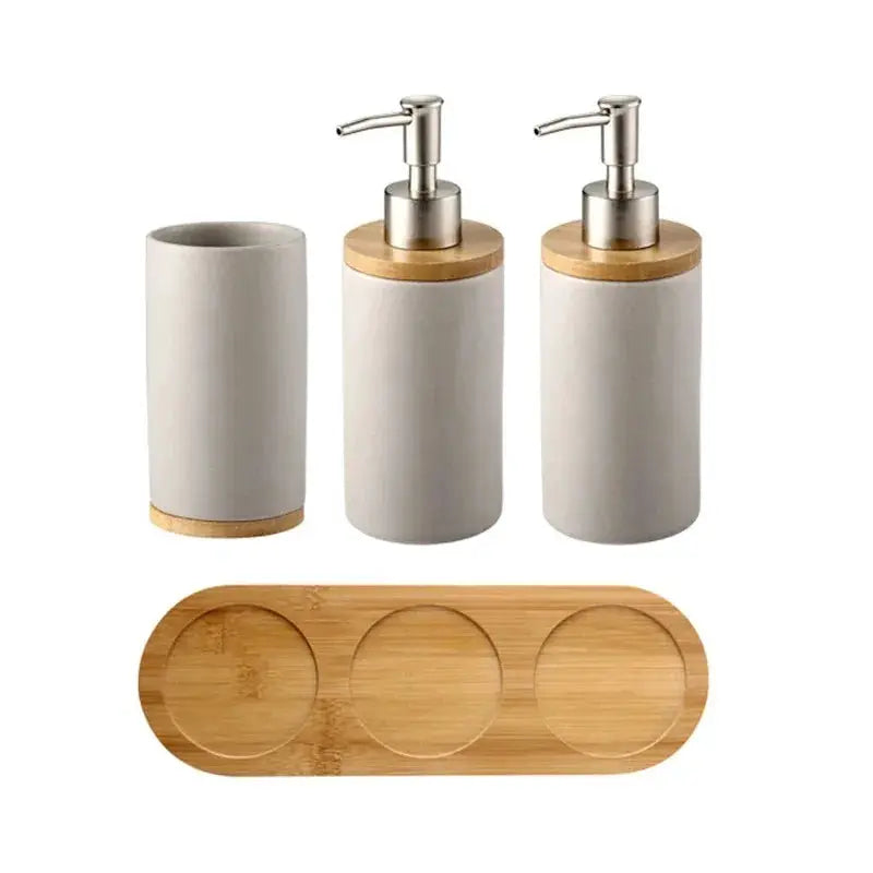 White ceramic 4-piece bathroom set with soap dispenser, toothbrush holder, tumbler and bamboo tray