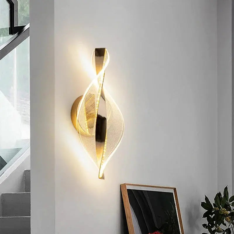 Nordic LED wall lamp by Simples Market, gold twisted acrylic design with warm ambient light for living rooms
