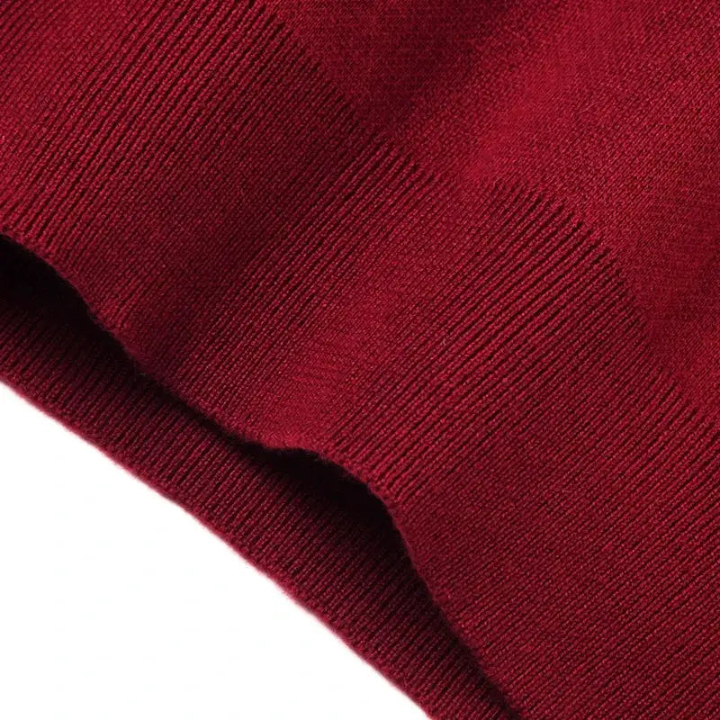Men's solid red knitted vest close-up with ribbed knit texture