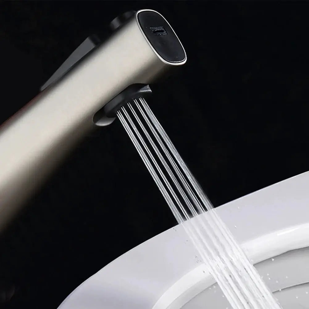 Toilet bidet handheld spray head with ABS body and chrome finish, water spray stream.