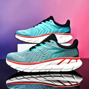 Pair of men's turquoise running shoes with black laces and white chunky sole