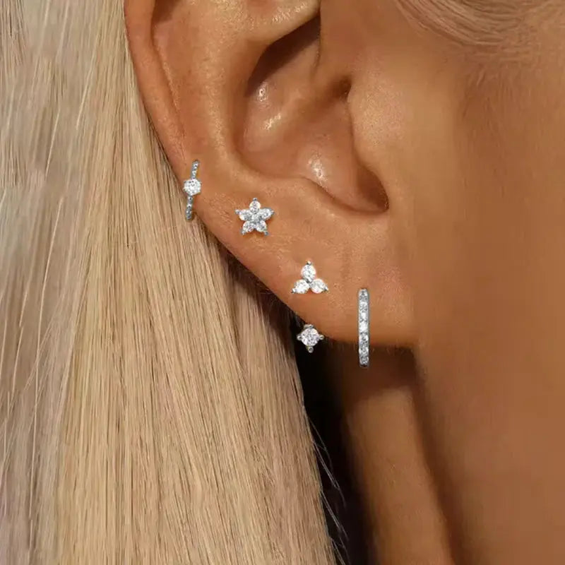 4-piece zircon earring set for women featuring flower/star studs and round huggie hoops