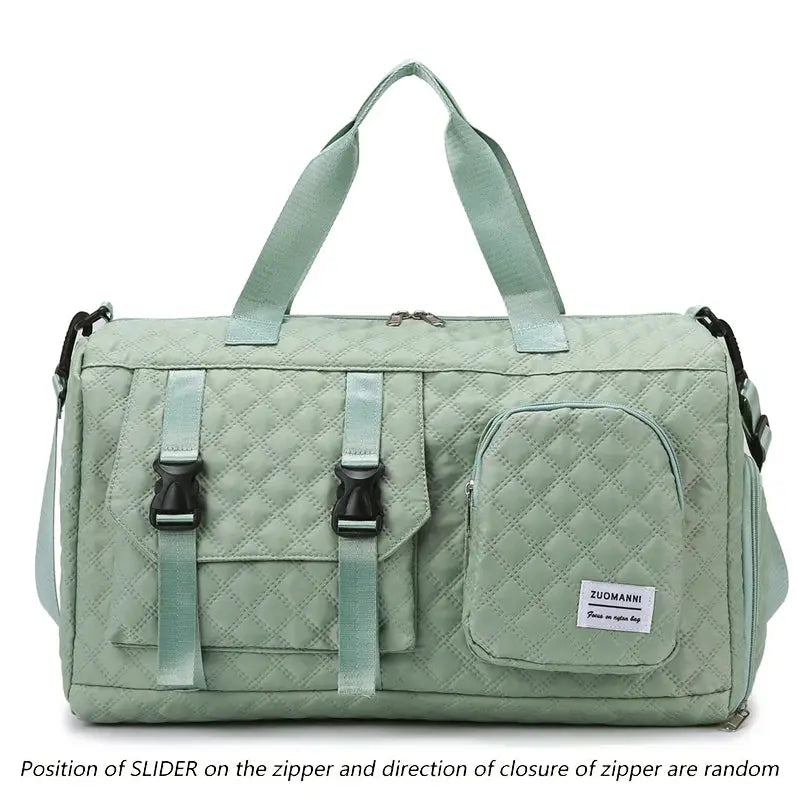 Mint green quilted travel duffel bag with top handles, shoulder strap, front buckle pockets and ZUOMANNI patch.