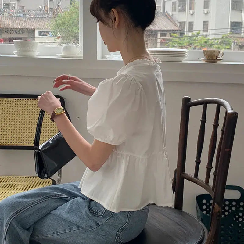 Women's white puff-sleeve peplum blouse; short sleeves, casual summer top