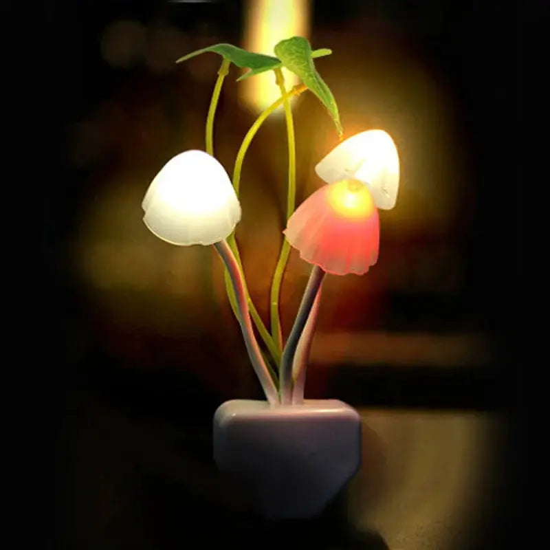 Novelty mushroom night light with three colorful LED mushrooms on a white base