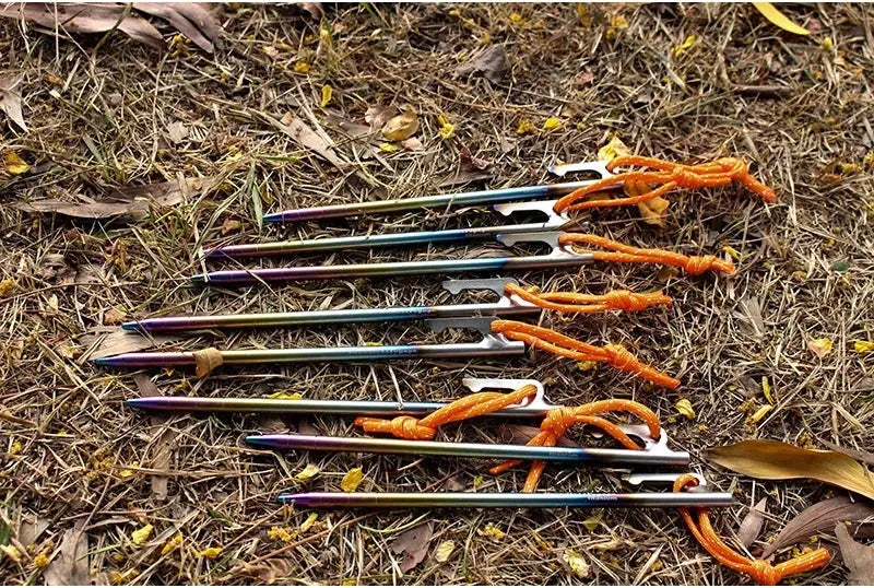 Boundless Voyage 6pcs titanium tent stakes with iridescent finish and orange cords