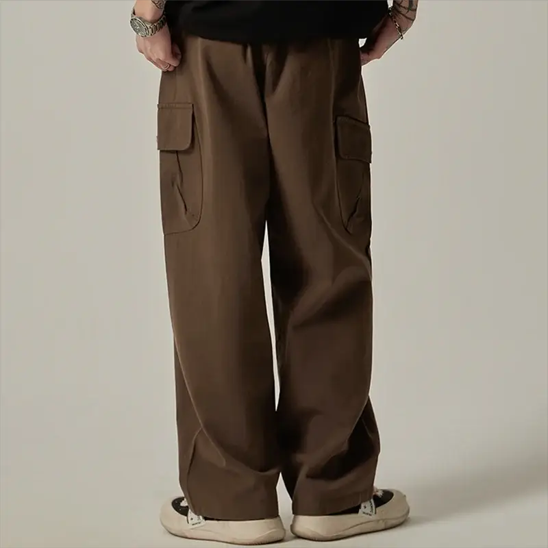 Men's cargo sweatpants by Simples Market in brown with large side pockets, drawstring waist, wide-leg.
