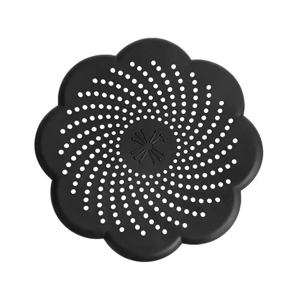 Flower-shaped silicone drain cover by Simples Market, black hair catcher for kitchen and bathroom.