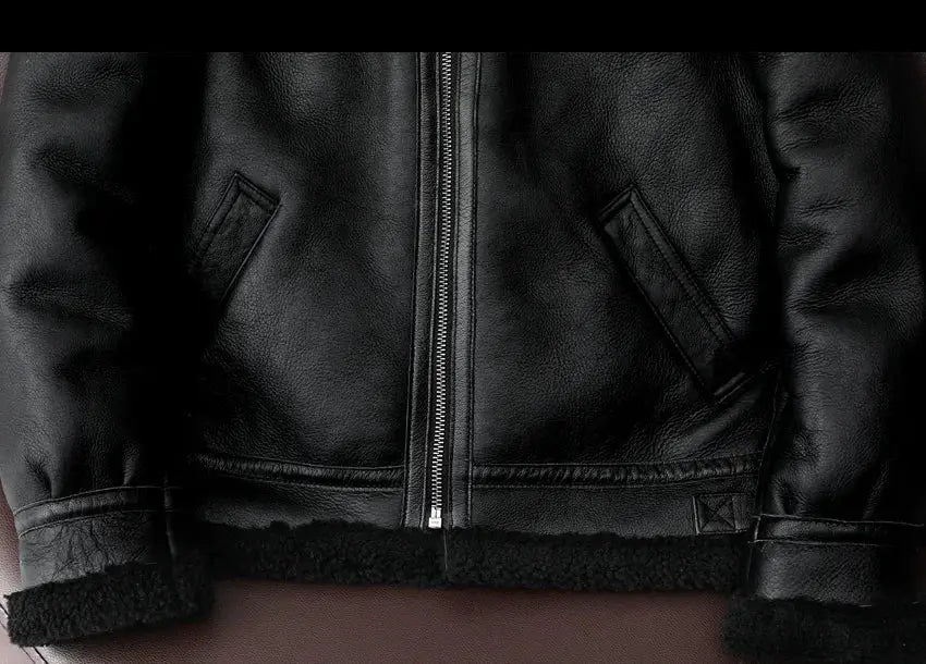 Black leather fur jacket with zip front and plush shearling trim; genuine sheepskin.