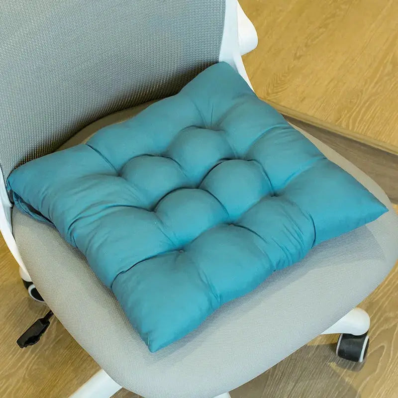 LMETJMA chair pad, teal tufted with ties, on a gray office chair