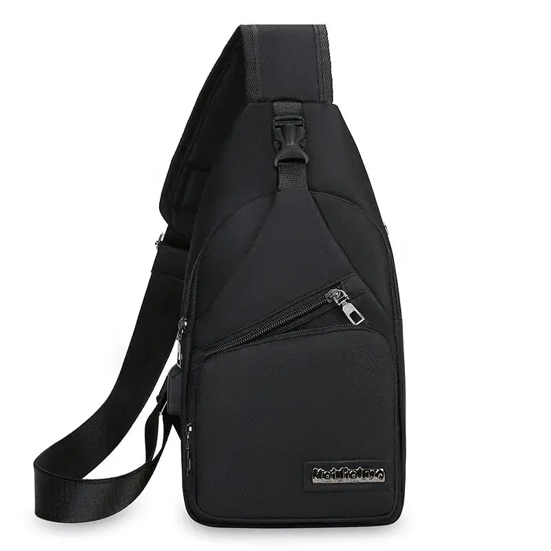 Men's chest bag by Simples Market, black lightweight canvas crossbody with diagonal zip pocket.