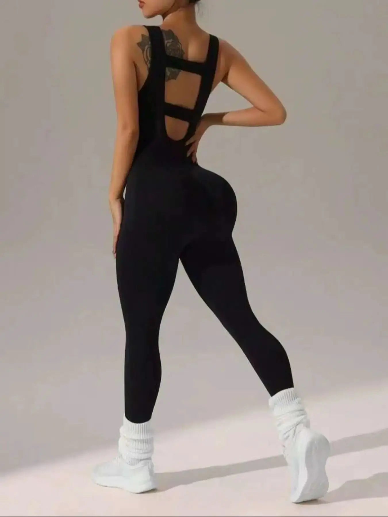 Women's black vest jumpsuit by Simples Market with elastic, soft fabric and hollow back design