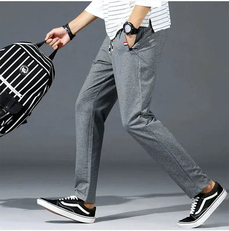 Men's grey cotton jogger pants with elastic waist, loose-fit gym track pants by Simples Market