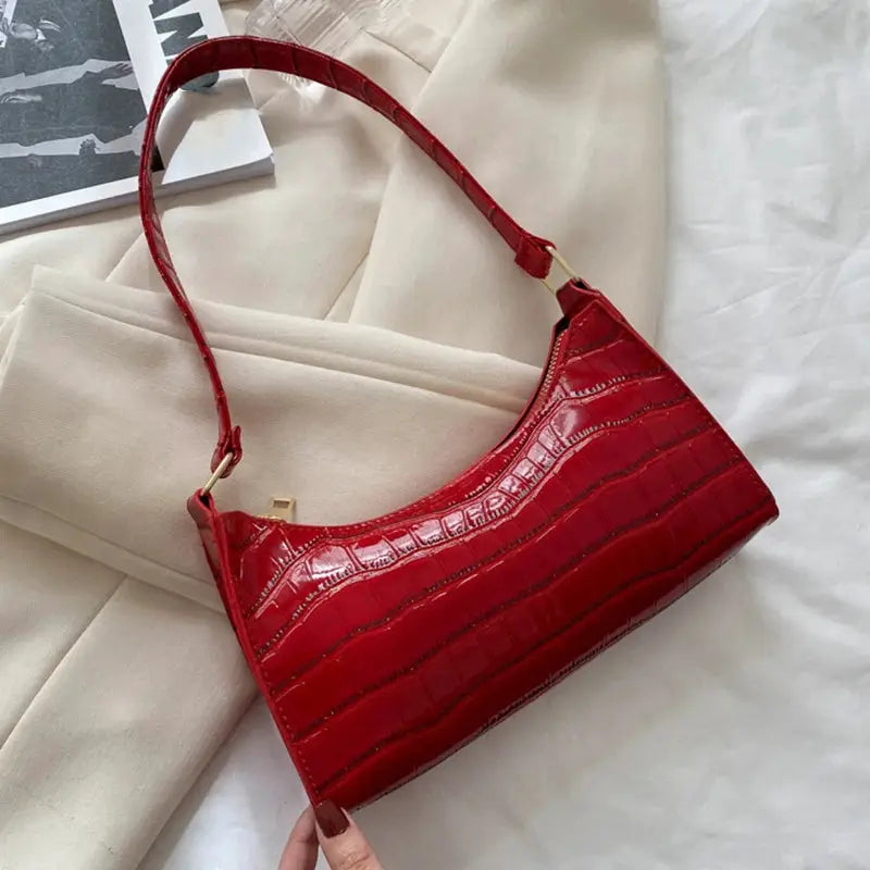 Red crocodile-embossed PU leather handbag with gold-tone hardware by Simples Market