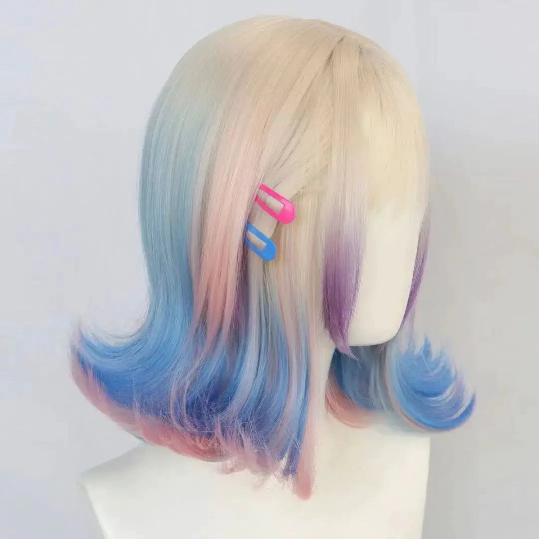 Enid Sinclair Addams Family cosplay wig with pastel rainbow ombre and pink/blue ends.