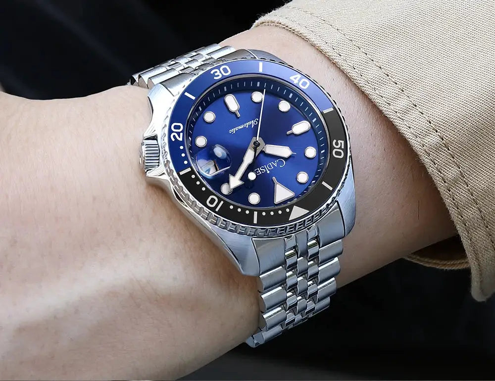 Cadisen men's automatic wristwatch with blue dial, luminous markers, and stainless steel bracelet