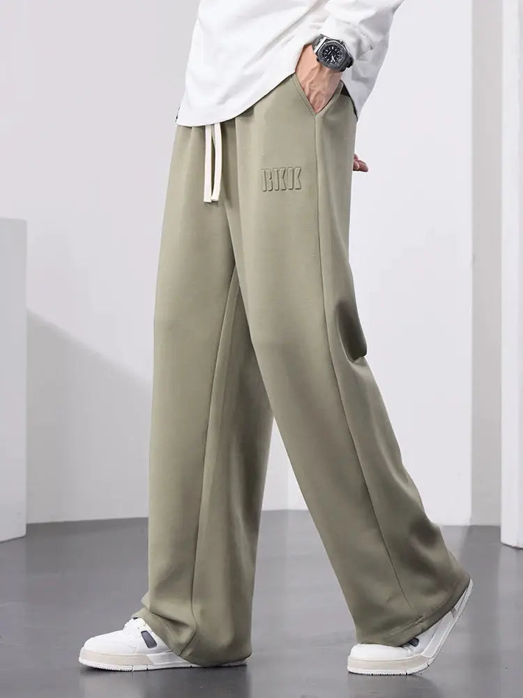 Men's olive-green cotton sweatpants with wide legs, drawstring waist, embossed lettering, size 8XL