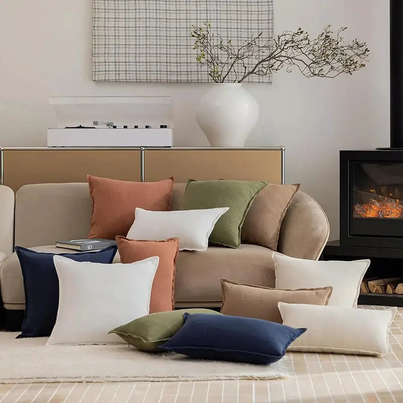 Decorative Ramie Cushion Covers by Simples Market in assorted colors on sofa and floor, boho farmhouse home decor